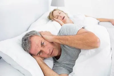 man awake due to his wife's sleep apnea