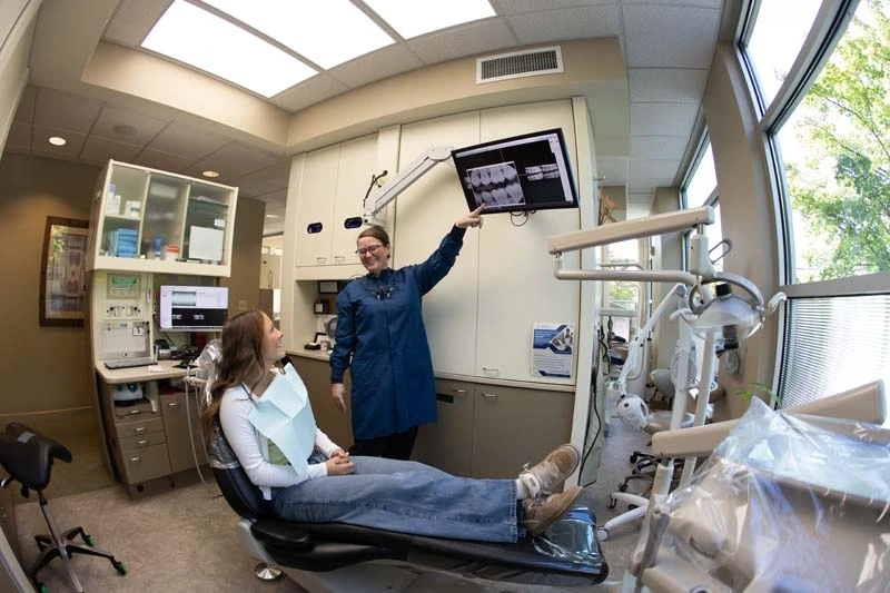 Patient and staff discussing dental veneer options at Olympia Advanced Dentistry
