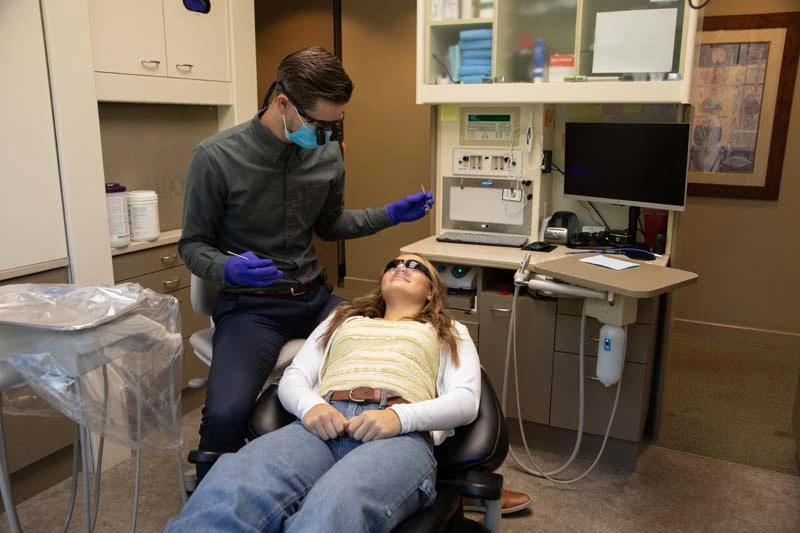 woman sleeping during her procedure at Olympia Advanced Dentistry