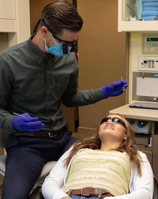 Dentist Dr. Tyler Tebay discussing sedation treatment with a patient in Olympia, WA.